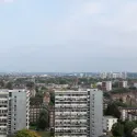 Skyline view across London with tower blocks and housing estates.