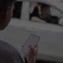 someone ordering a taxi on phone