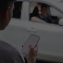 someone ordering a taxi on phone