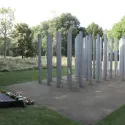 Image of the 7 July memorial in hyde park showing 52 column and a memorial plaque. 