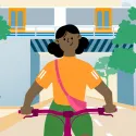 Close up illustration from the front of a woman wearing an orange top and a pink cross body bag riding a bike through a railway arch. A train is passing and trees are on both sides of the arch.