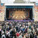 crowd of people in front of a stage at Trafalgar Square