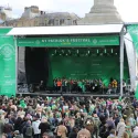 Photo of main stage with a crowd of people in front of it.