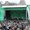 Photo of main stage with a crowd of people in front of it.