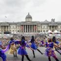 Image taken from stage at Trafalgar Square of backs of dancers and crowd watching. 
