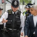 Mayor of London, Sadiq Khan, talking to a police officer on a visit