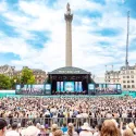 Cast of Mamma Mia on stage and view of the crowd at West End LIVE on Trafalgar Square, 2025