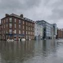 building submerged in flooding