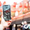 Person taking a picture using mobile phone