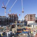 A construction site in London including crane and construction site workers