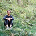 Volunteer sitting around greenery