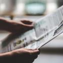 Person holding a newspaper