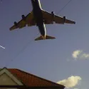 Plane over houses