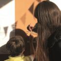 Mother and son looking at notice board