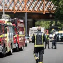 Fire trucks and firefighter outside of Grenfell Tower