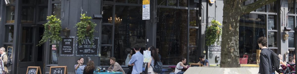 People sitting outside a London pub