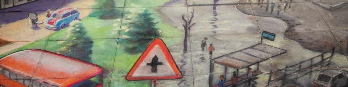 Art mural by renowned 3D pavement artist, Julian Beever. It shows parts of London flooded, with trees and a red bus.