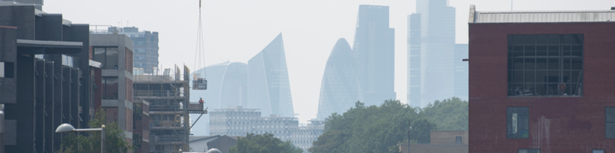 A very hazy view of London's skyline, featuring the Gherkin and the Walkie Talkie