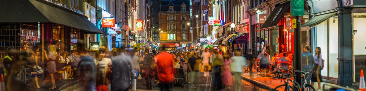 A busy commercial London street at night 