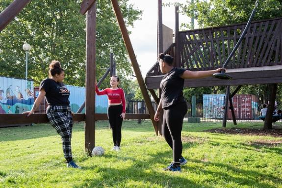 Young girls chatting on a playgound