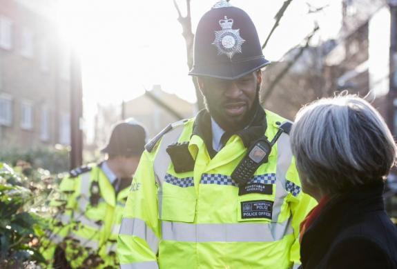 Police officer talking to member of the public