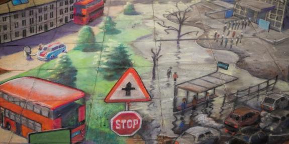 Art  mural by renowned 3D pavement artist, Julian  Beever. It shows parts of London flooded, with trees and a red bus.