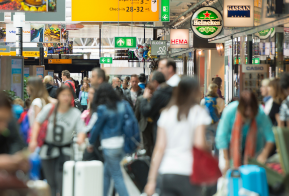 People with suitcases at an airport