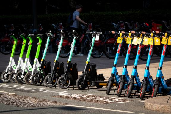 Rental e-scooters parked in an authorised bay in London