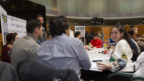 Londoners at a table discussing numbers during a City Hall events