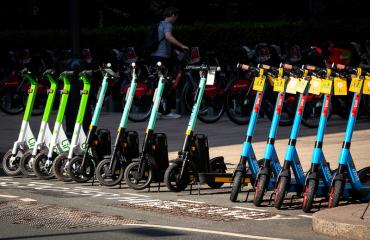 Rental e-scooters parked in an authorised bay in London