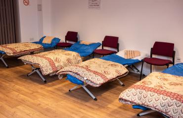 A row of beds at homeless charity St Mungo