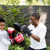 A mentee and their mentor try out boxing in one of their sessions